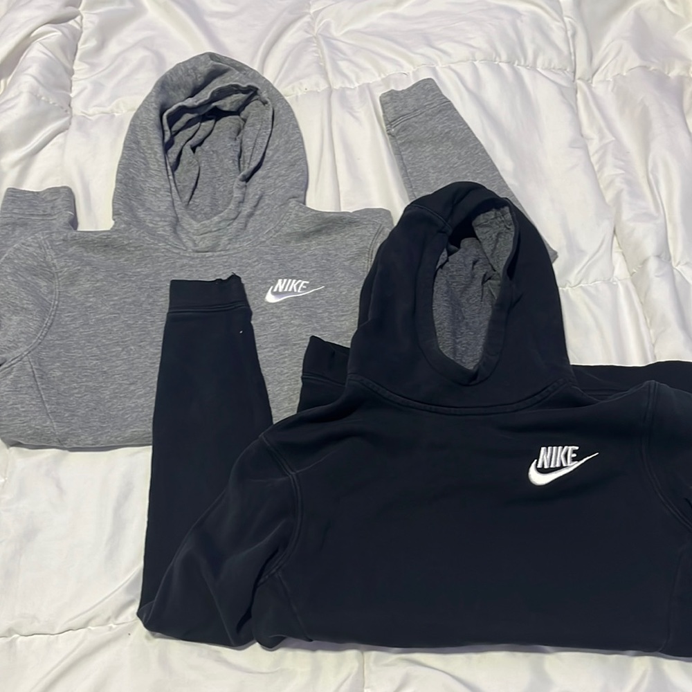 Grey and black Nike hoodies